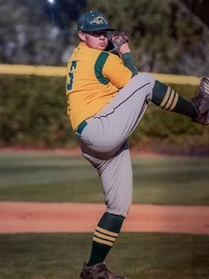 Vincent Bawden pitching a baseball with his right leg up